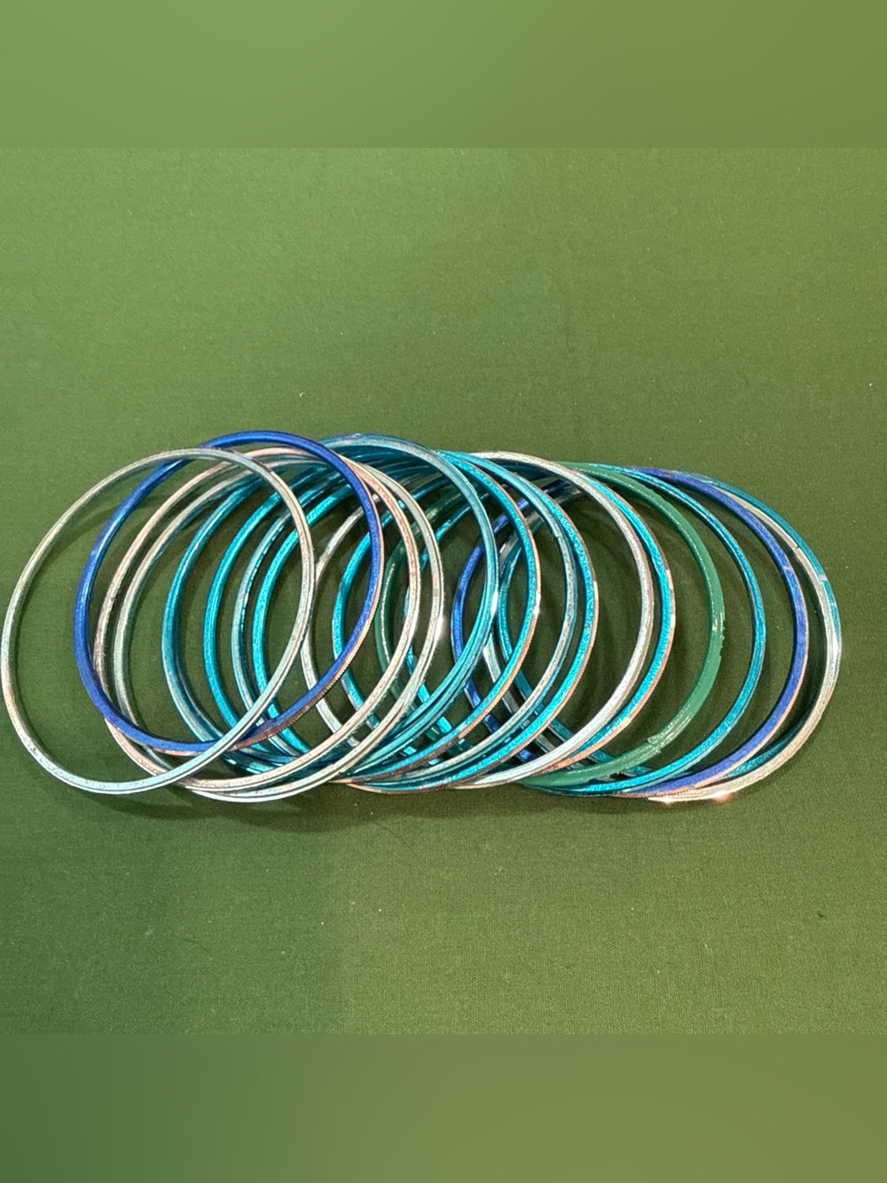 16 Shiny Teal Blue Stackable Bangle Bracelets. 115D